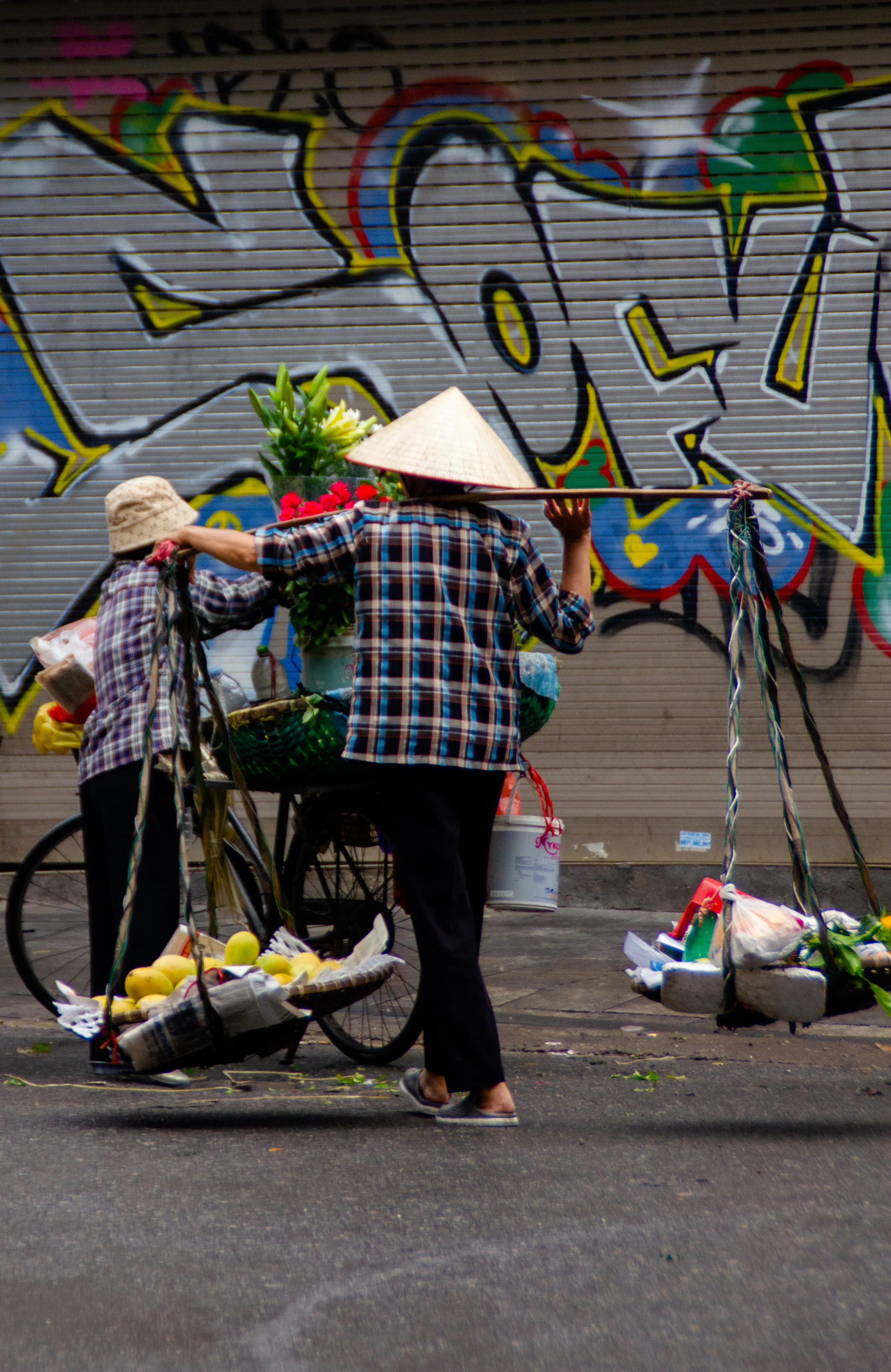 Merchant carrying around his produces through the streets 